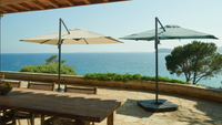 Two cantilever parasols on a terrace
