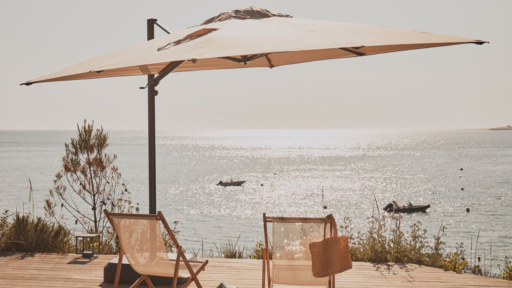 A parasol on a balcony overlooking the sea