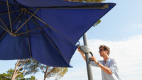 Man adjusting his parasol