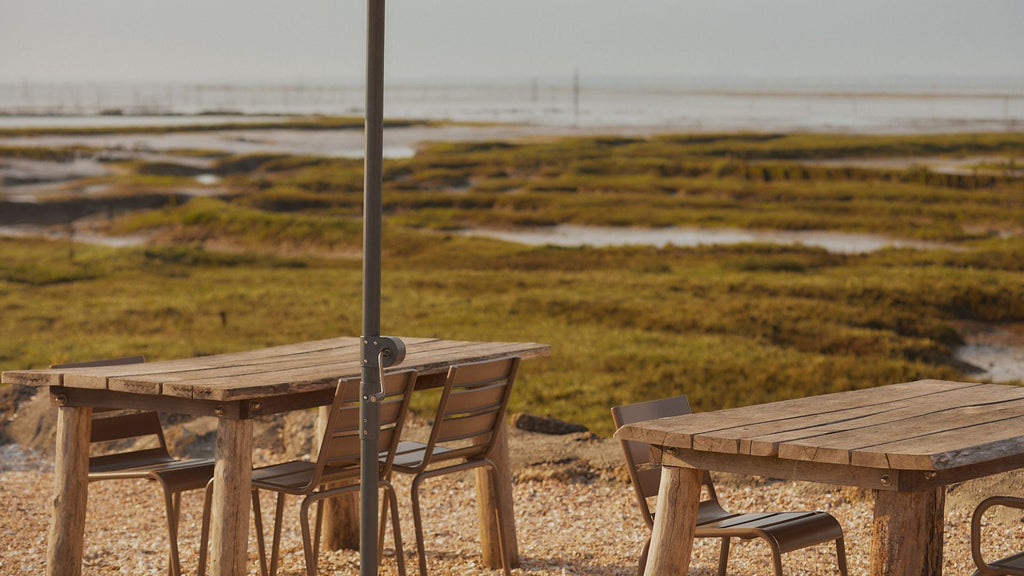 Garden tables and chairs under a parasol