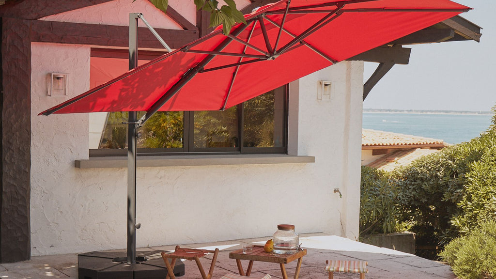 A red canopy offset parasol in a garden